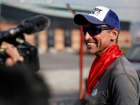 British climber Kenton Cool, 49, smiles while he speaks with the media personnel, upon his arrival at the airport, as he returns after completing his 17th ascent of Mount Everest, which is the most by any foreign climber, in Kathmandu, Nepal May 19, 2023.