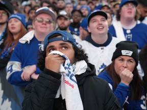 FILE - Fans in Maple Leaf Square react during first period NHL Stanley Cup playoff hockey action between the Toronto Maple Leafs and the Tampa Bay Lightning in Toronto on Thursday, April 27, 2023.