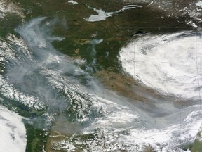 Smoke from wildfires burning in Western Canada can be seen in a Wednesday, May 17, 2023, satellite handout image.