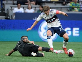 Houston Dynamo FC defender Franco Escobar (2) defends against Vancouver Whitecaps FC midfielder Ryan Gauld (25) during the first half at BC Place.