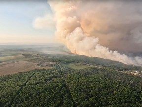 Smoke is shown as the Stoddart Creek wildfire burns in B.C. in this May 14, 2023, handout image taken from video.