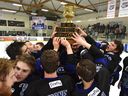 The Wenatchee Wild hold up the Doyle Cup as they celebrate defeating the Spruce Grove Saints 7-2 during Game 5 of the Cup at Grant Fuhr Arena in Spruce Grove, Alta., on May 4, 2018.