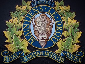 The RCMP logo is seen outside Royal Canadian Mounted Police "E" Division Headquarters, in Surrey, B.C., Friday, April 13, 2018. The RCMP say the investigation dubbed "OExplorer," which led to the rescue of 31 victims and the arrest of two suspects in London, Ont., last week, started in early 2023.