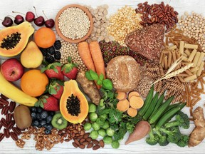 Food with high fiber content for a healthy diet with fruit, vegetables, whole wheat bread, pasta, nuts, legumes, grains and cereals.