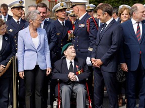 (From L) French Secretary of State for Veterans and Memory Patricia Miralles, French Prime Minister Elisabeth Borne, French WWII veteran of the Commando Kieffer Leon Gautier, French President Emmanuel Macron and British Secretary of State for Defence Ben Wallace attend a ceremony in tribute to the 177 French members of the "Commando Kieffer" Fusiliers Marins commando unit who took part in the Normandy landings, as part of the 79th anniversary of the World War II "D-Day" Normandy landings, in Colleville-Montgomery, Normandy, on June 6, 2023.