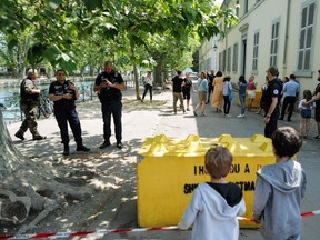 French police personnel maintain a secure cordon in Annecy, south-eastern France on June 8, 2023, following a mass stabbing in the French Alpine town.