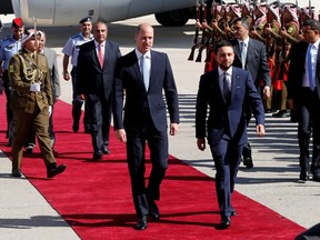 Britain's Prince William and Jordan's Crown Prince Hussein bin Abdullah II review the honour guard in Amman, Jordan, June 24, 2018.