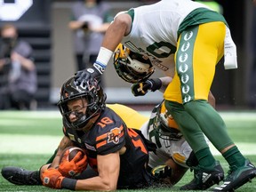 Loucheiz Purifoy pushes B.C. Lions wide receiver Justin McInnis