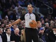 FILE - Referee Eric Lewis gestures during the first half of Game 5 of the NBA basketball Eastern Conference semifinal between the New York Knicks and the Miami Heat on May 10, 2023, in New York. Lewis was not selected as one of the 12 referees who will work the NBA Finals between the Denver Nuggets and Miami Heat, while the league continues to look into whether he used a Twitter account to defend himself and other officials from online critiques. Lewis had been chosen to work the finals in each of the last four seasons.