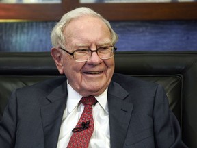 FILE - Berkshire Hathaway Chairman and CEO Warren Buffett smiles during an interview in Omaha, Neb., May 7, 2018. After 17 years of steady payments, including those announced Wednesday, June 21, 2023, Buffett has given annual donations totaling $50.7 billion toward his historic multibillion-dollar pledges to the Bill & Melinda Gates Foundation and to four foundations connected to his family.