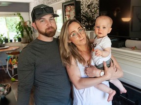 James and Angela Bates, with their 10-month-old son James, at their Delta home on June 3.