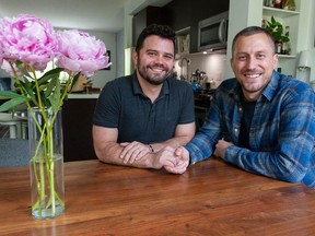 Aaron, left, and Kyle Demes at their home in Port Moody on June 15. The married couple are searching for a surrogate so they can have a baby.
