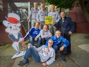 Former CFUN DJs (top row, from left) Red Robinson, Terry David Mulligan, Ed Kargl and Roy Hennessy. (Sitting middle, from left) Chuck McCoy, Doc Harris, Tom Jeffries. And laying down is John Tanner. In front of 1906 West 4th Ave. in Vancouver in 2019.