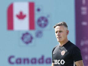 Canada head coach John Herdman watches his team during practice at the World Cup in Doha, Qatar, on Nov. 28, 2022.