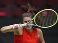 Canada's Rebecca Marino watches her shot after returning to Belgium's Ysaline Bonaventure during a Billie Jean King Cup qualifiers singles match, in Vancouver, on Friday, April 14, 2023.&ampnbsp;Marino has been eliminated from the Rothesay Classic tennis tournament after a 4-6, 6-3, 6-2 quarterfinal loss to China's Zhu Lin on Friday. THE&ampnbsp;CANADIAN PRESS/Darryl Dyck