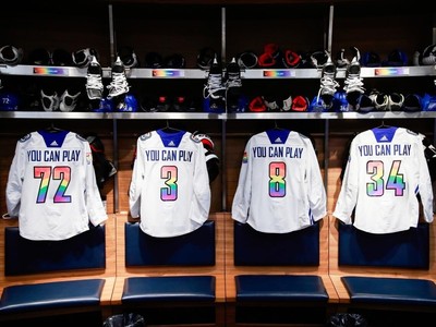 Vancouver Canucks' J.T. Miller wears a pride-themed warmup jersey