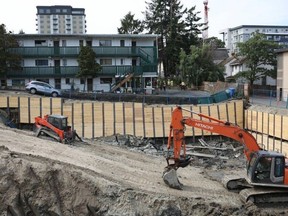 About 30 residents of two Esquimalt apartment buildings were evacuated Tuesday morning after a driveway next to an excavation site collapsed. June 13, 2023. Photo: Darren Stone.