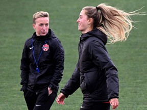 Canada's coach Bev Priestman (left) and Jordyn Huitema take part in a training session.