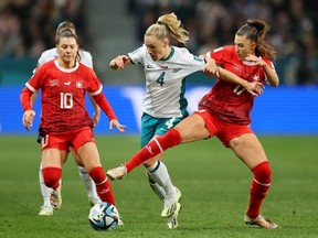 C.J. Bott of New Zealand competes for the ball against Ramona Bachmann and Seraina Piubel of Switzerland during the FIFA Women's World Cup Australia & New Zealand 2023 Group A match between Switzerland and New Zealand at Dunedin Stadium on July 30, 2023 in Dunedin, New Zealand.