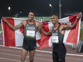 Canada's Damian Warner, right, celebrates his gold medal win in the decathlon with teammate Pierce LePage who won bronze at the Pan Am Games in Lima, Peru on Wednesday, Aug. 7, 2019.