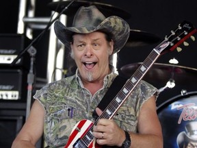 Rock legend Ted Nugent rehearses his performance during a sound check at the DTE Energy Music Theater on July 4, 2008 in Clarkston, Michigan.