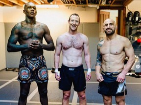 Mark Zuckerberg with UFC champs Alex Volkanovski (right) and Israel Adesanya.