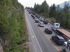 Cars line up along the Sea to Sky Highway after a closure on Tuesday afternoon.