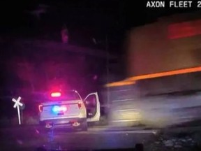 A Colorado police vehicle containing Yareni Rios-Gonzalez is struck by an oncoming train in this screenshot from a police dashcam. (/)