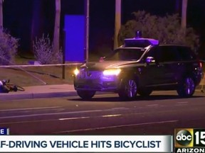 FILE - In this image taken from video provided by ABC-15, an investigator works at the scene of a fatal accident involving a self driving Uber car in Tempe, Ariz., March 19, 2018. Rafaela Vasquez, the backup Uber driver involved in the first death involving a fully autonomous vehicle, has pleaded guilty to endangerment.(ABC-15.com via AP, File)