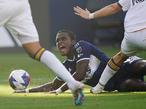 Vancouver Whitecaps forward Sergio Córdova reacts after falling during the first half of an MLS soccer match against the Los Angeles Galaxy, Sunday, July 30, 2023, in Carson, Calif.