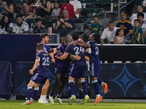 Vancouver Whitecaps celebrate after a goal by Vancouver Whitecaps forward Brian White during the second half of a Leagues Cup soccer match, Sunday, July 30, 2023, in Carson, Calif.