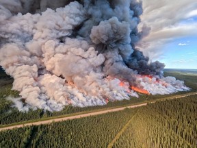 The Donnie Creek wildfire burns in an area between Fort Nelson and Fort St. John, B.C., in this undated handout photo provided by the BC Wildfire Service. Tackling British Columbia's largest-ever wildfire involves a combination of protecting homes and infrastructure, and letting it burn, the province says.