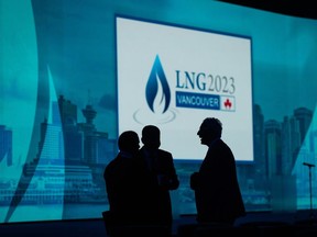 Delegates are silhouetted before the start of the LNG 2023 conference, in Vancouver, B.C., Monday, July 10, 2023. Officials from the LNG industry gathering in Vancouver for an industry conference say the consensus among economists is that the gas shortage in Europe is a situation unlikely to last beyond 10 years, with the rise of renewables cutting into demand from 2030 onward.