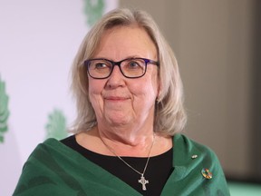 Green Party Leader Elizabeth May is home after a brief stay in hospital for overwork, fatigue and stress according to a statement on her website. May stands on stage before the new leader of the Green Party is chosen in Ottawa on Saturday, November 19, 2022.