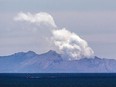 FILE: Steam rises from the White Island volcano two days after a volcanic eruption off the coast of Whakatane on December 11, 2019.