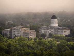 FILE - The morning fog lifts beyond the Burton M. Cross Building, left, and the State House, Wednesday, June 21, 2023, in Augusta, Maine. Maine lawmakers are meeting ,Thursday, July 6, 2023, for votes to enact a bill expand access to abortions and to override a bill to allow more federal laws to apply to Native American tribes in the State.