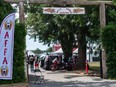 There's a heavy police presence as Hells Angels and associates arrive at the motorcycle club's White Rock clubhouse in Langley, BC Saturday, July 22, 2023. Hundreds of bikers from across Canada are expected at the compound to celebrate the White Rock chapter's 40th anniversary. (Photo by Jason Payne/ PNG)