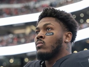 Las Vegas Raiders running back Josh Jacobs stands on the sideline before playing the Kansas City Chiefs in an NFL game on Jan. 7, 2023, in Las Vegas. The Raiders and Jacobs are at a contract impasse after a long-term extension was not reached.