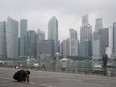 A man takes a nap as the central business district is shrouded by haze in Singapore, on Sept. 23, 2019.