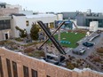 An aerial view shows a newly constructed X sign on the roof of the headquarters of the social media platform previously known as Twitter, in San Francisco, on July 29, 2023.