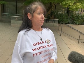 Sharon Bursey speaks to reporters outside the Vancouver Law Courts on Sept. 29, 2022, after caregiver Astrid Dahl received a 12-month conditional sentence in connection with the death of Bursey's sister, Florence Girard.