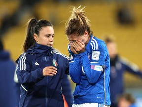 Cristiana Girelli (R) of Italy is consoled after the team's 2-3 defeat and the elimination from the tournament following the FIFA Women's World Cup Australia and New Zealand 2023 Group G match between South Africa and Italy at Wellington Regional Stadium on August 02, 2023 in Wellington, New Zealand. (Photo by Catherine Ivill/Getty Images)