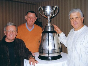 Bobby Ackles (l), David Braley (c) and Wally Buono with the Grey Cup from November 2006 from Ackles' book Water Boy.