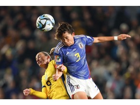 Japan's defender #03 Moeka Minami and Sweden's midfielder #09 Kosovare Asllani contest a header during the Australia and New Zealand 2023 Women's World Cup quarter-final football match between Japan and Sweden at Eden Park in Auckland on August 11, 2023.