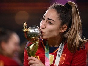 Spain's defender #19 Olga Carmona kisses the trophy after winning the Australia and New Zealand 2023 Women's World Cup final football match between Spain and England at Stadium Australia in Sydney on August 20, 2023.