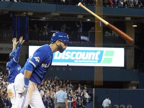 In an unforgettable moment, former Blue Jay Jose Bautista flips his bat after hitting a home run against the Texas Rangers during the ALDS in 2015. Stan Behal/Toronto Sun