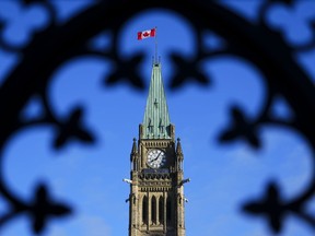 The Canadian flag flies atop the Peace Tower on Parliament Hill in Ottawa on May 5, 2023. Ottawa says law enforcement is "engaged" after a video circling online appears to threaten Indian diplomats in Canada.