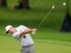 Nick Taylor was exhausted after his three-round playoff where he edged out Tommy Fleetwood to win the RBC Canadian Open. Taylor makes an approach shot on hole 6 during final round Canadian Open golf championship action in Toronto, Sunday, June 11, 2023.