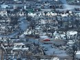 In an aerial view, burned cars and homes are seen in a neighbourhood that was destroyed by a wildfire on Aug. 18, 2023 in Lahaina, Hawaii.