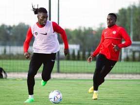 Samuel Adekugbe and Richie Laryea at a Canadian men's national team training session in September 2022